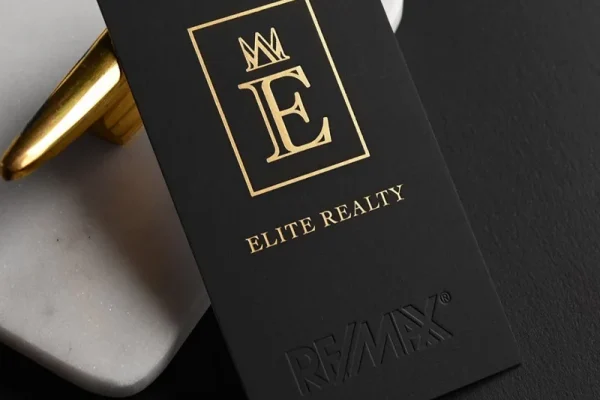 Luxury business card with gold foil for Elite Realty, showcasing premium printing.