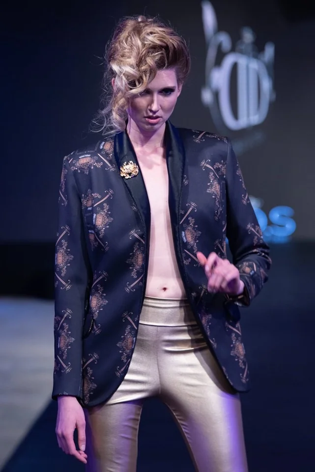 Model wearing a blazer with custom printed fabric, showcasing fashion fabric printing.