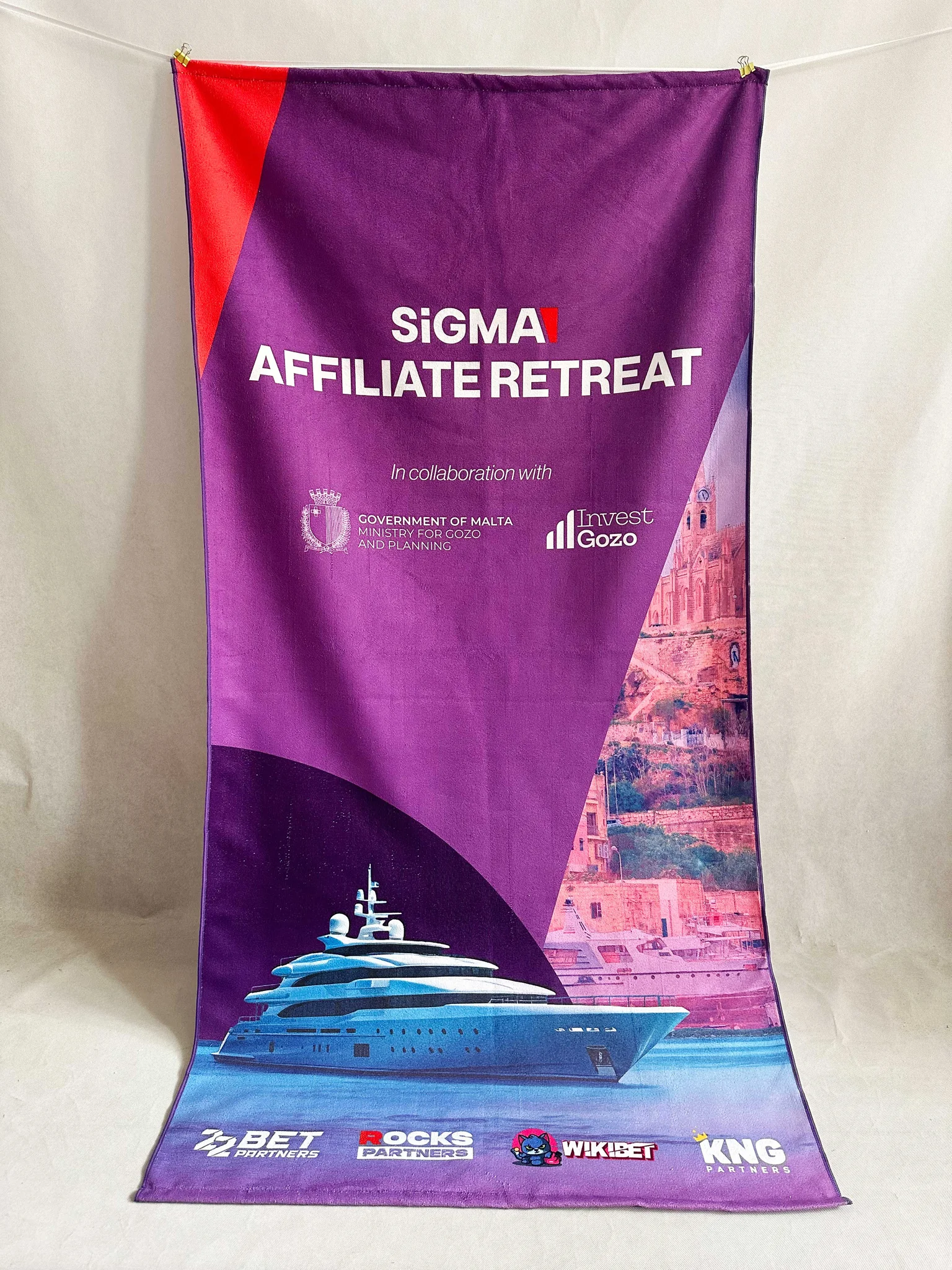 Canvas banner for SiGMA Affiliate Retreat with yacht and sponsor logos.